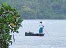 Fijian woman poling her boat